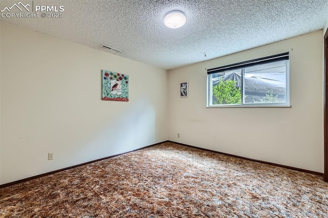3286 Inspiration Dr, Colorado Springs, CO 80917 - empty room featuring carpet, a textured ceiling, and baseboards