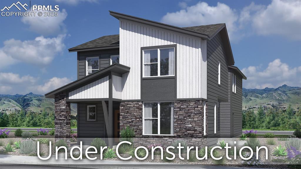 3588 Greenways Main Blvd, Colorado Springs, CO 80922 - view of side of home featuring stone siding and a mountain view