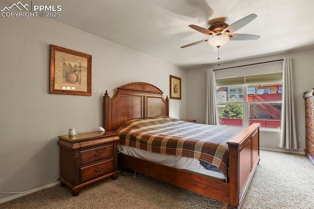 6557 Many Moon Dr, Colorado Springs, CO 80923 - bedroom with light colored carpet, ceiling fan, and baseboards