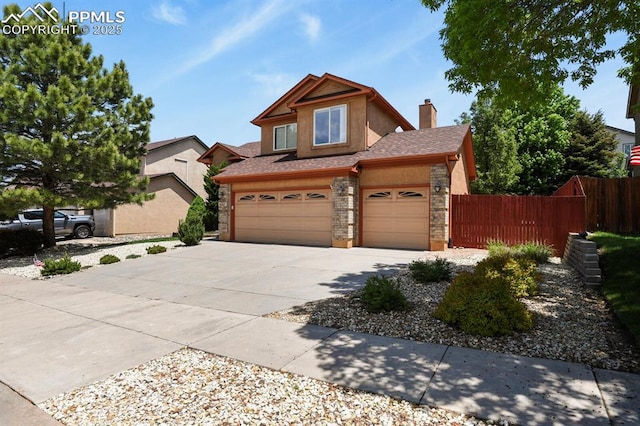 6557 Many Moon Dr, Colorado Springs, CO 80923 - view of front of house with concrete driveway, stucco siding, a garage, a chimney, and stone siding