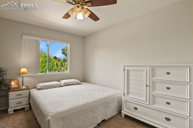 6557 Many Moon Dr, Colorado Springs, CO 80923 - bedroom with dark colored carpet and ceiling fan