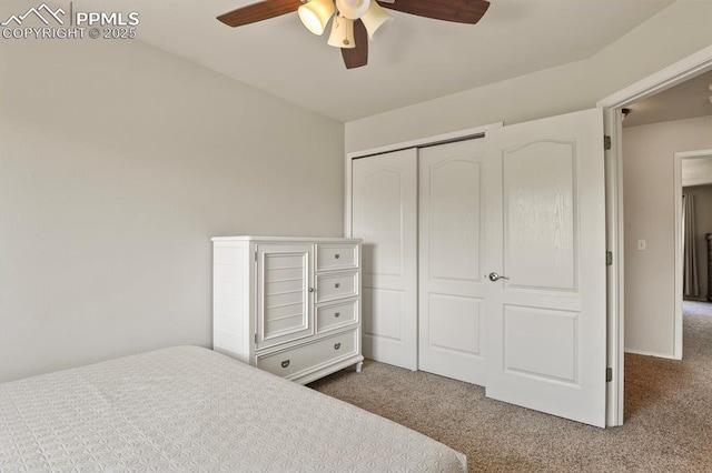 6557 Many Moon Dr, Colorado Springs, CO 80923 - bedroom with dark colored carpet, a closet, and ceiling fan