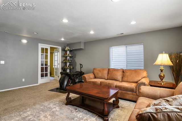 6557 Many Moon Dr, Colorado Springs, CO 80923 - living room with carpet flooring, french doors, baseboards, and recessed lighting