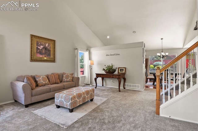 6557 Many Moon Dr, Colorado Springs, CO 80923 - living room with a chandelier, carpet flooring, plenty of natural light, high vaulted ceiling, and baseboards