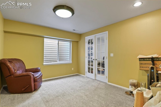 6557 Many Moon Dr, Colorado Springs, CO 80923 - living area with french doors, carpet flooring, baseboards, and recessed lighting