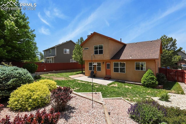 6557 Many Moon Dr, Colorado Springs, CO 80923 - back of house with a patio, stucco siding, and a shingled roof