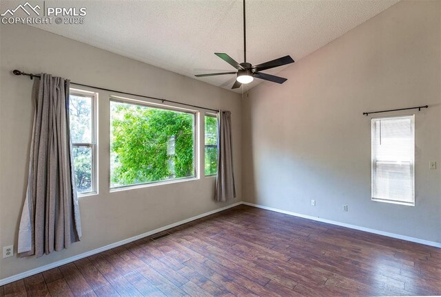 7435 Julynn Rd, Colorado Springs, CO 80919 - unfurnished room with hardwood / wood-style floors, vaulted ceiling, plenty of natural light, ceiling fan, and a textured ceiling