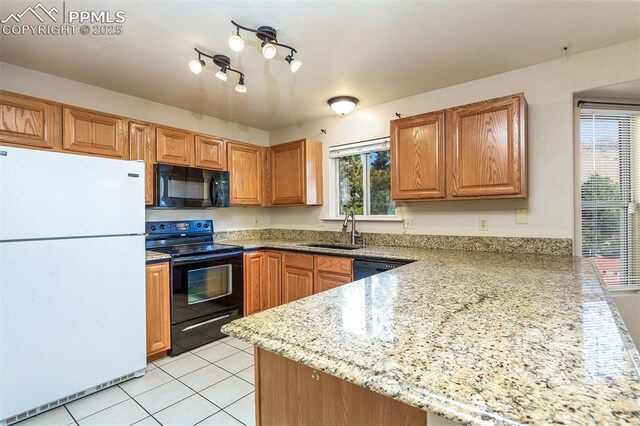7435 Julynn Rd, Colorado Springs, CO 80919 - kitchen featuring black appliances, a sink, a peninsula, light tile patterned floors, and light stone countertops