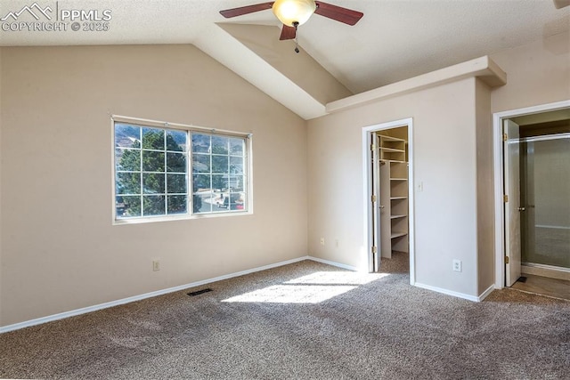 7435 Julynn Rd, Colorado Springs, CO 80919 - unfurnished bedroom featuring carpet flooring, a spacious closet, lofted ceiling, baseboards, and a ceiling fan