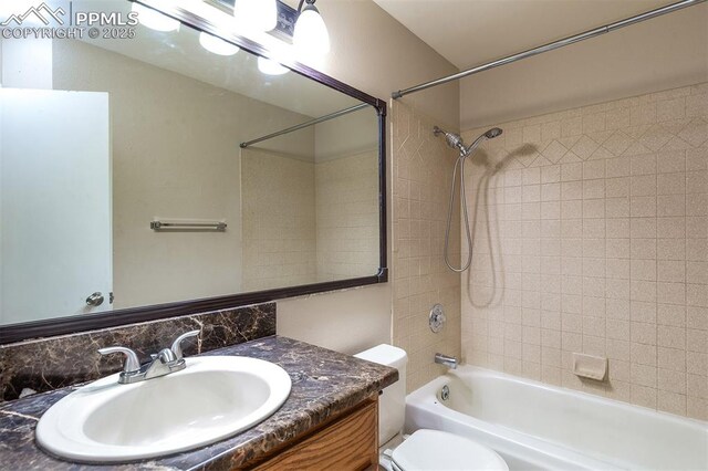 7435 Julynn Rd, Colorado Springs, CO 80919 - bathroom featuring toilet, bathtub / shower combination, and vanity