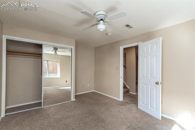 7435 Julynn Rd, Colorado Springs, CO 80919 - unfurnished bedroom featuring carpet floors, a closet, baseboards, and a ceiling fan