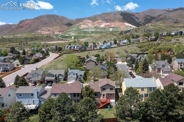 7435 Julynn Rd, Colorado Springs, CO 80919 - aerial view of property and surrounding area with nearby suburban area and mountains