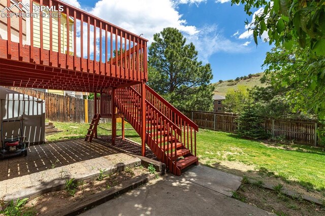 7435 Julynn Rd, Colorado Springs, CO 80919 - view of patio / terrace featuring a wooden deck and stairway