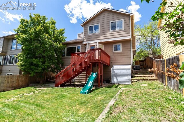 7435 Julynn Rd, Colorado Springs, CO 80919 - rear view of property with stairs and a deck