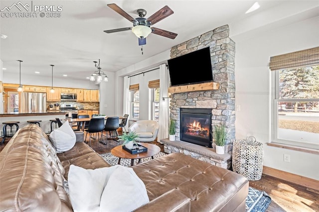 404 S Willow St, Woodland Park, CO 80863 - living room with wood finished floors, healthy amount of natural light, ceiling fan, and recessed lighting