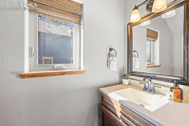 404 S Willow St, Woodland Park, CO 80863 - bathroom with vanity and a textured wall