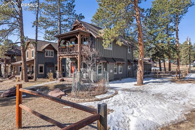 404 S Willow St, Woodland Park, CO 80863 - back of house featuring board and batten siding and a balcony
