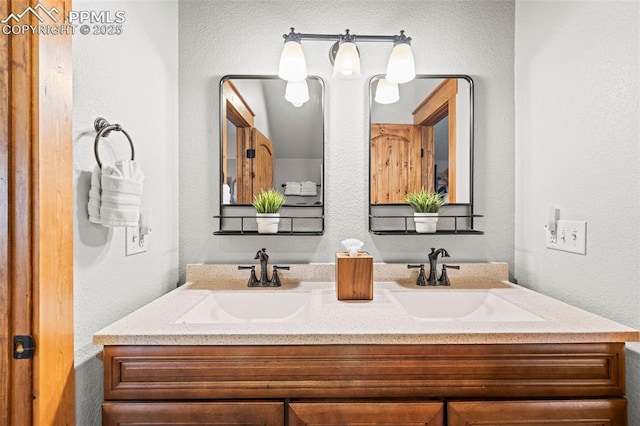 404 S Willow St, Woodland Park, CO 80863 - full bathroom with double vanity and a textured wall