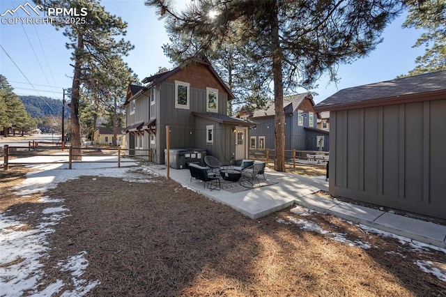 404 S Willow St, Woodland Park, CO 80863 - rear view of house with a patio area, outdoor lounge area, board and batten siding, and a residential view