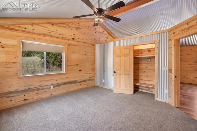 621 Yorktown Rd, Cripple Creek, CO 80863 - unfurnished bedroom with wooden walls and carpet flooring