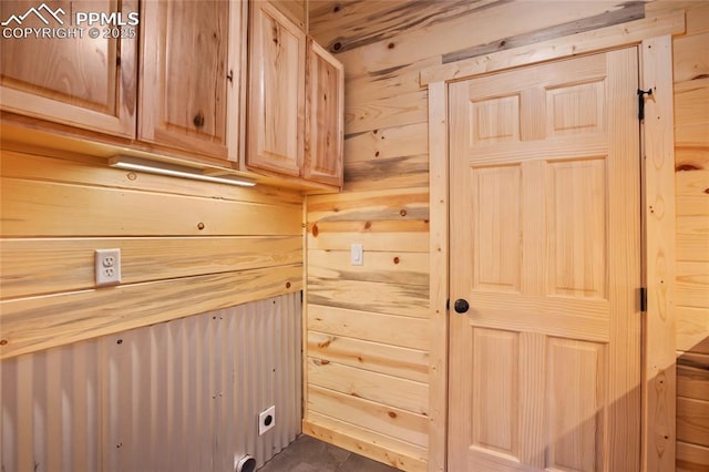 621 Yorktown Rd, Cripple Creek, CO 80863 - laundry room with cabinet space, wood walls, and hookup for an electric dryer