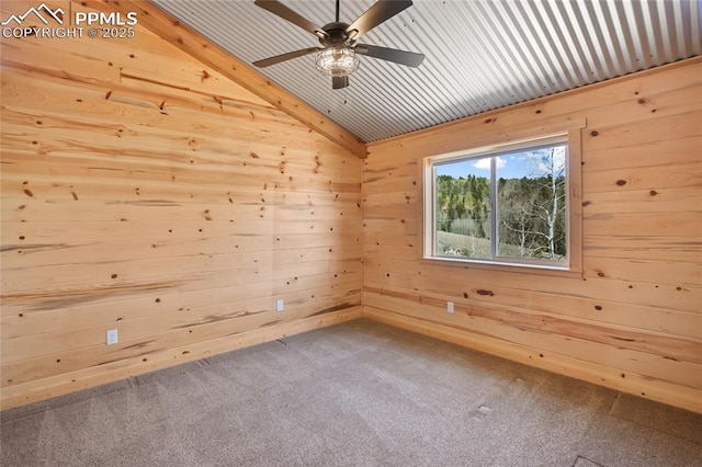 621 Yorktown Rd, Cripple Creek, CO 80863 - unfurnished room with wood walls, lofted ceiling, carpet floors, and ceiling fan