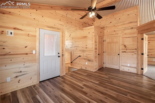 621 Yorktown Rd, Cripple Creek, CO 80863 - foyer entrance featuring wooden walls, dark wood-type flooring, ceiling fan, and beamed ceiling