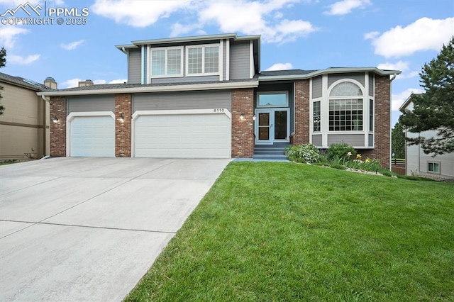 8110 Routt Ct, Colorado Springs, CO 80919 - view of front facade featuring a front yard, driveway, brick siding, and entry steps