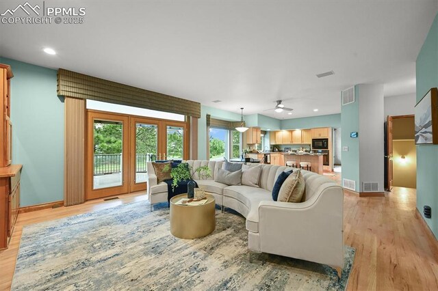 8110 Routt Ct, Colorado Springs, CO 80919 - living room featuring ceiling fan, light wood-style flooring, and recessed lighting