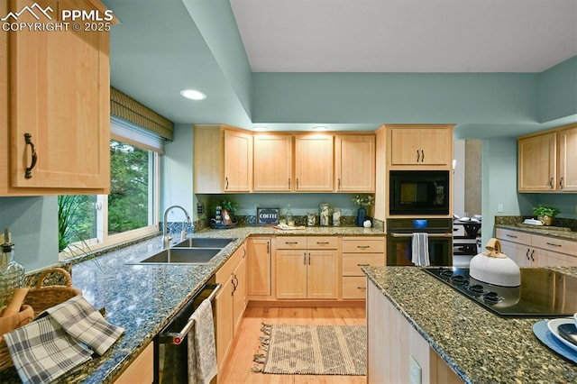 8110 Routt Ct, Colorado Springs, CO 80919 - kitchen featuring black appliances, light brown cabinets, light wood-type flooring, dark stone countertops, and recessed lighting