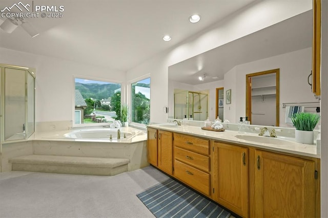 8110 Routt Ct, Colorado Springs, CO 80919 - full bath with a shower stall, a bath, double vanity, and recessed lighting