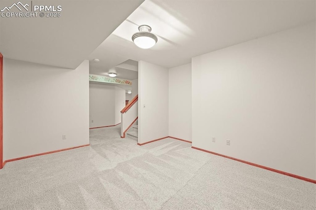 8110 Routt Ct, Colorado Springs, CO 80919 - carpeted empty room featuring baseboards and stairway