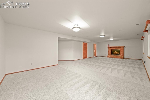 8110 Routt Ct, Colorado Springs, CO 80919 - unfurnished living room with light colored carpet and a brick fireplace