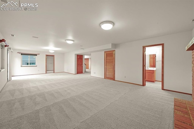 8110 Routt Ct, Colorado Springs, CO 80919 - empty room with light carpet and a fireplace