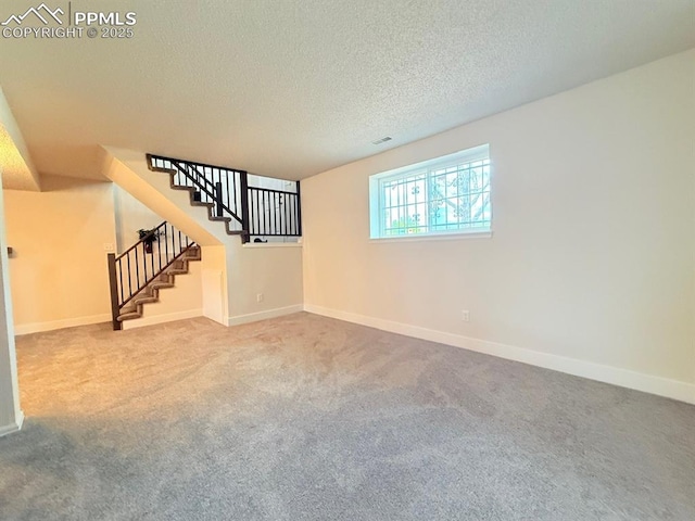 4770 Newton Dr, Colorado Springs, CO 80916 - carpeted empty room featuring baseboards, stairs, and a textured ceiling