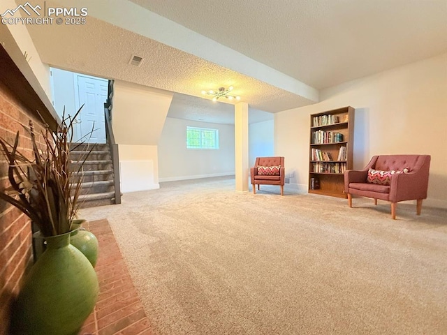 4770 Newton Dr, Colorado Springs, CO 80916 - living area featuring carpet floors, a textured ceiling, stairway, and baseboards