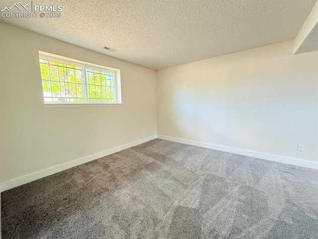 4770 Newton Dr, Colorado Springs, CO 80916 - carpeted empty room with baseboards and a textured ceiling