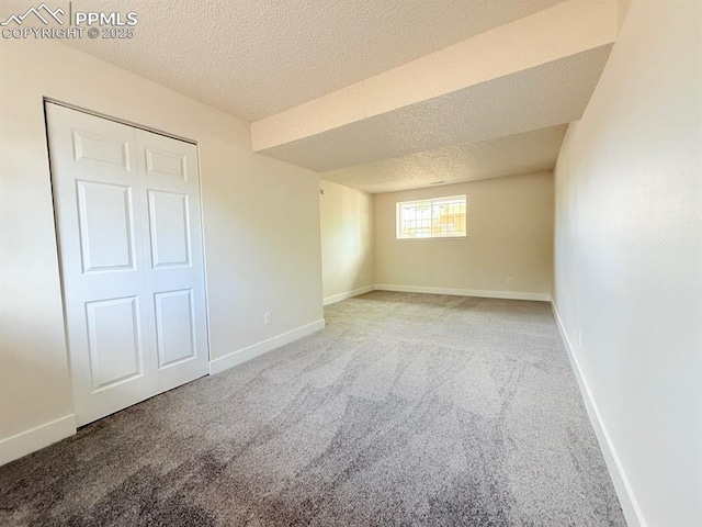 4770 Newton Dr, Colorado Springs, CO 80916 - unfurnished bedroom with a textured ceiling, carpet floors, and baseboards