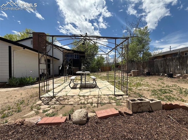 4770 Newton Dr, Colorado Springs, CO 80916 - fenced backyard with a patio area