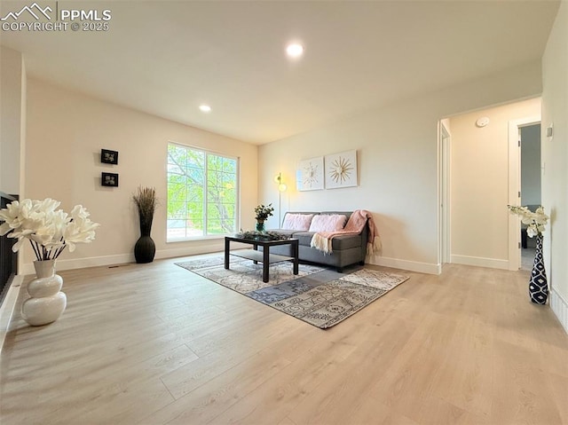 4770 Newton Dr, Colorado Springs, CO 80916 - living area with wood finished floors, baseboards, and recessed lighting