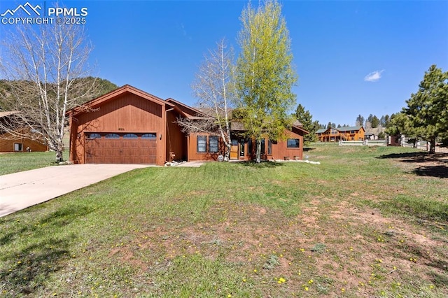 802 Red Eagle Ct, Woodland Park, CO 80863 - single story home featuring a garage, a front lawn, and driveway