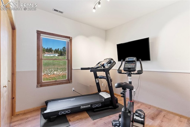802 Red Eagle Ct, Woodland Park, CO 80863 - exercise area with wood finished floors and baseboards