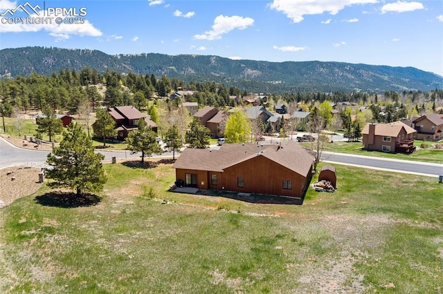 802 Red Eagle Ct, Woodland Park, CO 80863 - aerial view of residential area with a mountain backdrop
