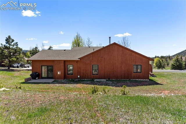 802 Red Eagle Ct, Woodland Park, CO 80863 - back of house featuring a lawn