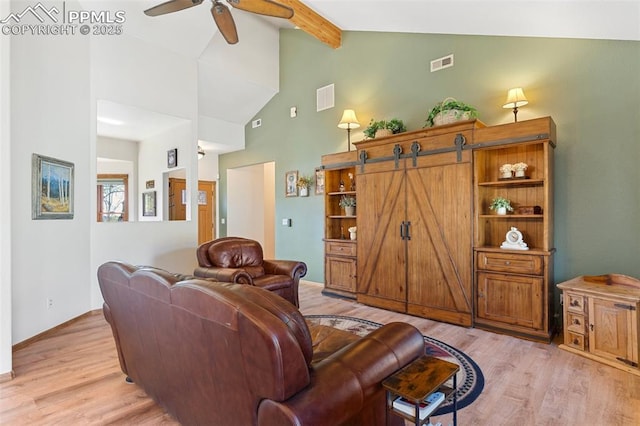 802 Red Eagle Ct, Woodland Park, CO 80863 - living area with light wood-style floors, beam ceiling, a ceiling fan, high vaulted ceiling, and baseboards