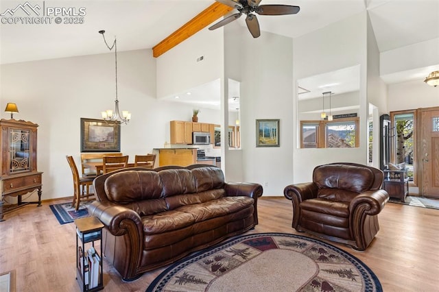 802 Red Eagle Ct, Woodland Park, CO 80863 - living area with ceiling fan, a chandelier, light wood-type flooring, high vaulted ceiling, and beamed ceiling