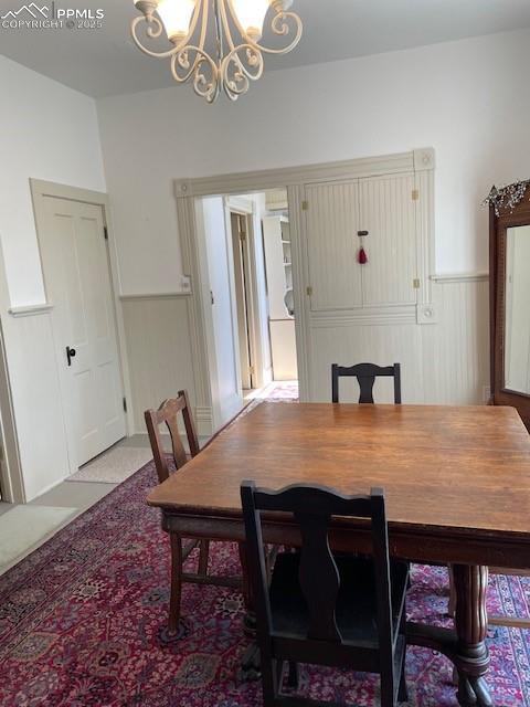 304 N 4th St, Victor, CO 80860 - dining area with a chandelier and wainscoting