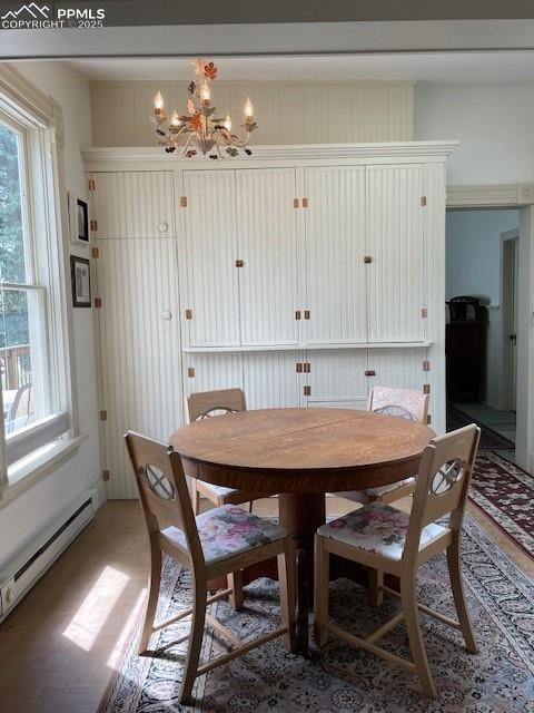 304 N 4th St, Victor, CO 80860 - dining room with baseboard heating and a chandelier