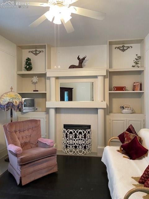304 N 4th St, Victor, CO 80860 - bedroom with a fireplace and a ceiling fan