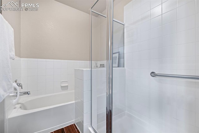 6678 Bethesda Pt Unit C, Colorado Springs, CO 80918 - bathroom with a shower stall, a garden tub, and wood finished floors